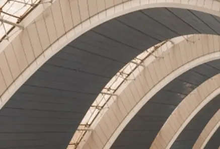 Architectural design of repeated arches, illustrating the foundational support provided by expert investment banking advisory and capital markets services
