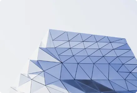 Modern building with a complex, geometric facade, symbolizing expert management consulting and strategic financial structuring.